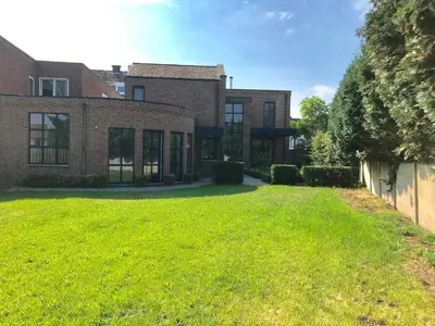 an empty yard in front of a brick building at Vakantiehuis Piantho in Overpelt