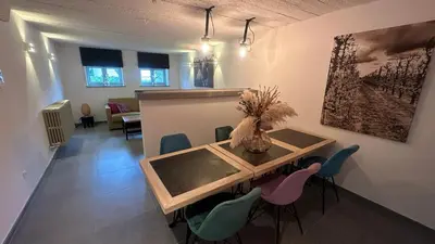 a dining room with a table and chairs at Bed & Bets! in Geetbets