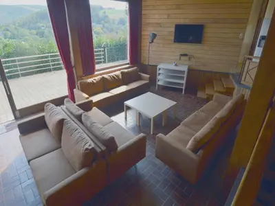a living room with a couch and a table at Trooz Villa with Pool & Sauna in Trooz