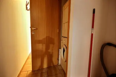 a door to a laundry room with a washing machine at Thier à Liege - hauts-sart in Liège