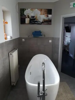a bath tub in a bathroom with a sink at Villa Marco 176 in Cerexhe-Heuseux