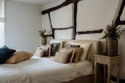a bedroom with a bed with pillows on it at B&B Hof van Vervoering in Voeren