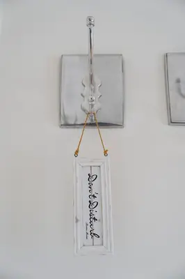 a glass bottle hanging on a wall at B&B Hof van Vervoering in Voeren