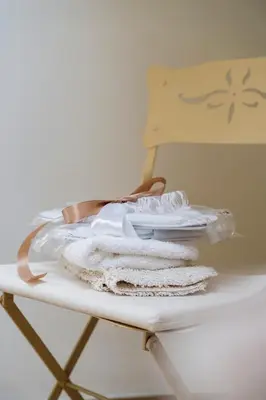 a pile of towels sitting on a table at B&B Hof van Vervoering in Voeren