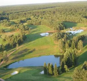 an aerial view of a golf course with a lake at Charme chalet in Zutendaal