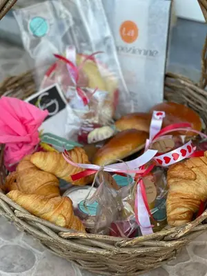a basket filled with breads and pastries at SintPieter17 Lo-Ghis vakantiewoning in Voeren