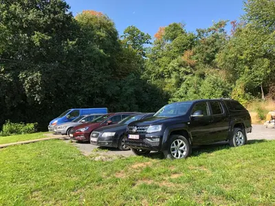 a row of cars parked in a parking lot at Joff in Budingen