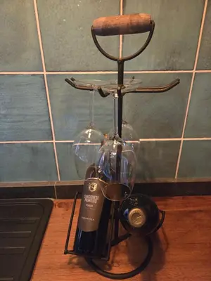 a bottle of wine on top of a counter at Een vleugje wellness in de Voerstreek - Bed & Brocante Onder de Poort in Voeren