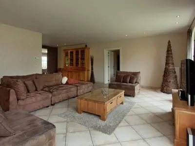 a living room with couches and a christmas tree at Peer Villa with Garden in Peer