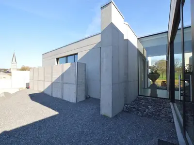 a building with a large window on the side of it at Cozy Villa in Dalhem Ardennes with Private Garden in Dalhem