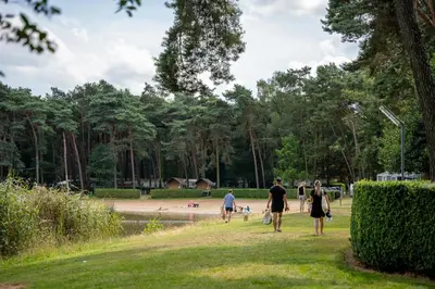 a group of people walking in a park at Familiepark Goolderheide in Bocholt