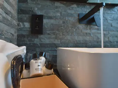 a bathroom with a sink and a white toilet at Modern Dalhem Villa with Views in Dalhem