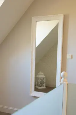 a mirror on a staircase in a room at 'Op de Borgt' met Finse Grill Kota in Wellen