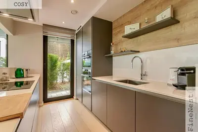 a kitchen with a sink and a window at Résidence de 3 appartements luxueux - 2 ch x 3 - 
