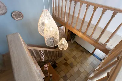 an overhead view of a staircase with a chandelier at Vakantiehuis Elisa in Alken