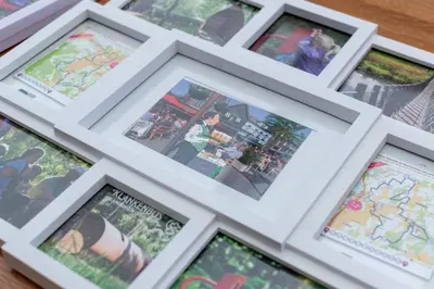 a group of framed photographs on a table at Vakantiewoning Pelterheggen in Grote Heide