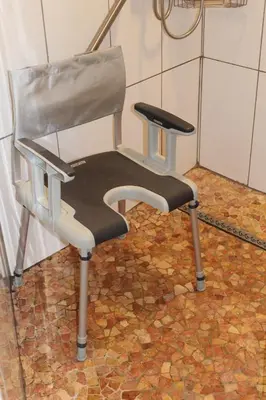 a chair sitting in a room with a table at Éco Gîtes Aubelrando & villa-bocage in Aubel