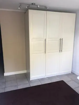 a room with white cabinets and a wall at Vivere in Houthalen-Helchteren