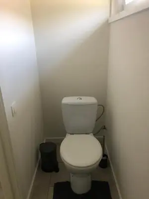 a bathroom with a white toilet in a room at Vivere in Houthalen-Helchteren