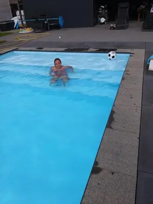 a person in a swimming pool with a soccer ball at Vivere in Houthalen-Helchteren
