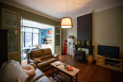 a living room with a couch and a table at B&B Gaudium XII in Tongeren
