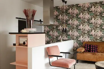 a living room with a chair and a couch at Time-Out Zussen in Riemst