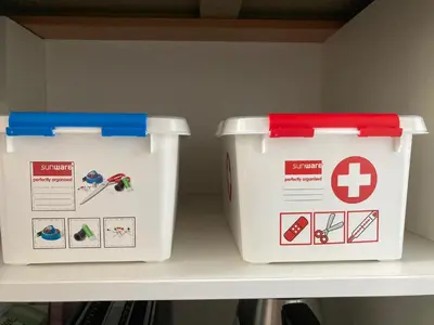 two plastic containers are sitting on a shelf at Le petit béguinage in Tongeren