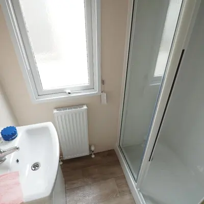 a bathroom with a sink and a shower at Vakantiepark Wilhelm Tell Superieur Chalet in Oudsbergen