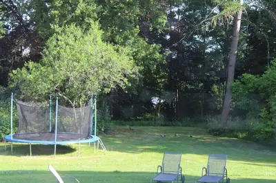 two chairs and a trampoline in a yard at B&B Chatelet Cremers in Verviers