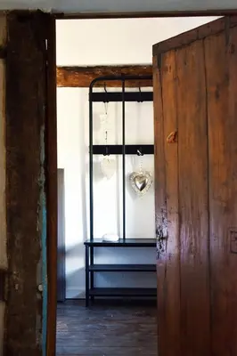 an open door to a room with a table at Vakantiewoning Veurservallei in Voeren