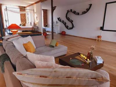 a living room with a couch and a table at Baiser de Cupidon in Verviers