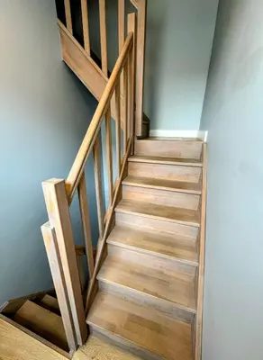 a stairway with wooden steps in a room at Le Boisseliège in Liège
