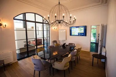 a dining room with a table and chairs at Burgemeesterhuys in Beringen