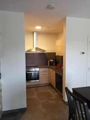 a kitchen with a stove and a microwave at Vakantiewoning Atuatuca in Tongeren
