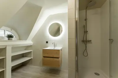 a bathroom with a shower and a sink at Vakantiewoning De zandberg in Pelt