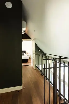 a room with a staircase leading to a bedroom at Kolisheide in Peer