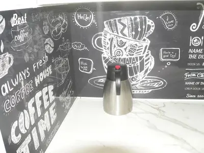 a thermos in front of a blackboard with drawings on it at Liège centre 6 rue montagne sainte Walburge, 4000 Liège, pour 2 pers à 3 minutes de la gare st Lambert in Liège
