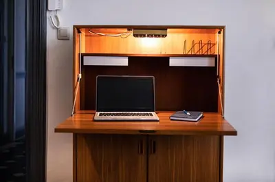 a desk with a laptop computer on top of it at GITADIN - Deluxe Suite Rousseau - Historical center in Liège