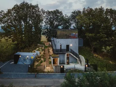 a house on top of a hill with trees at Kindadom - Maison pour vacances insolites et inoubliables en Belgique in Montzen