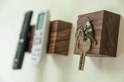a couple of keys hanging from a wooden box at Bed & Breakfast Nummer5 in Heusden - Zolder