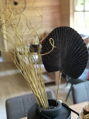 a black umbrella sitting on top of a table at Chalet Sint-Hubertus Deluxe in Zutendaal