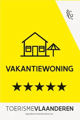 a yellow sign with a house and five stars at Huize Idalie in Bilzen