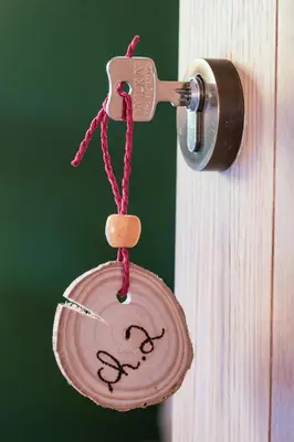 a key chain hanging from a door knob at Un air de bourlingueurs in Pepinster