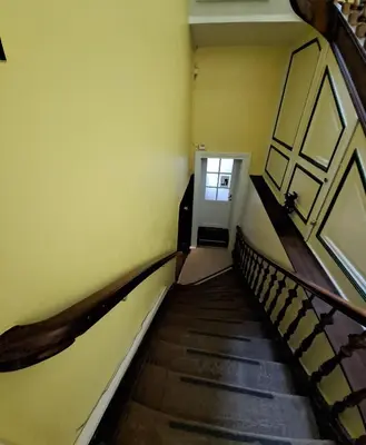 a staircase in a building with a door at Le Piercot in Liège