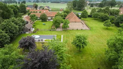 an aerial view of a house with a large yard at Wabi Sabi B&B in Peer