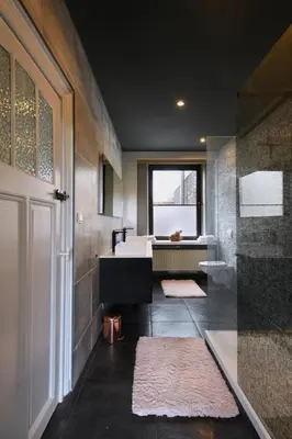 a bathroom with a sink and a tub and a window at Rue Haute by M&M 4 sterren bed en breakfast vlakbij Maastricht in Eben-Emael