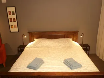 a bedroom with a bed with two towels on it at Bosrand81 in Hechtel
