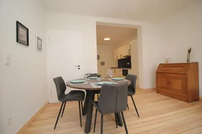 a dining room with a table and chairs at Appart Nicolas in Eupen