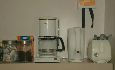 a kitchen counter with a food processor and a blender at Holiday Home Op 't Busselen in Opoeteren