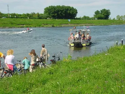 a group of people on a boat on a river at Viva La Vie in Maaseik